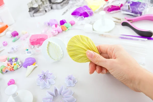 Artist makes jewelry from polymer clay, process. Workshop — Stock Photo, Image