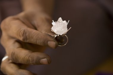 VARANASI, INDIA - MAY: Jeweler Making Jewelry. Handwork. May 15, clipart