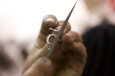 VARANASI, INDIA - MAY: Jeweler Making Jewelry. Handwork. May 15,