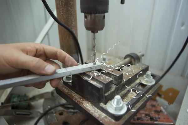 Man drilling in Steel Plate with Bench Drill. Close-up Electric — 스톡 사진