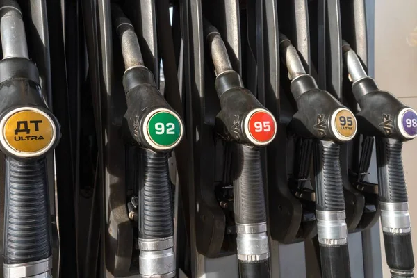 series of manual refueling nozzles for feeding diesel and gasoline into the vehicle's gas tank. Gas station, February 2021
