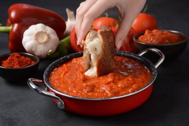 Matbucha - Moroccan Tomato dip, spread or condiment - Cooked Spicy Tomatoes, Peppers, Garlic and Chili Pepper clipart