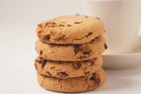 Delicious homemade vanilla flavor cookies with chocolate chips on white background