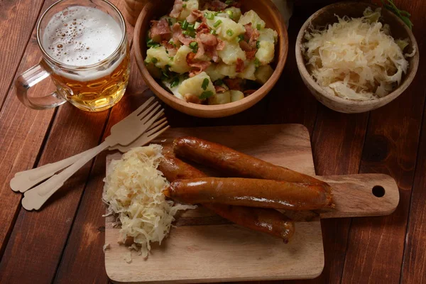 Grilled sausages with sauerkraut. German food