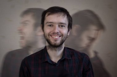 Zihinsel sorunları ve bölünmüş kişiliği olan deli bir adamın portresi. Duyguları bastırma ve dış sakinlik kavramı.