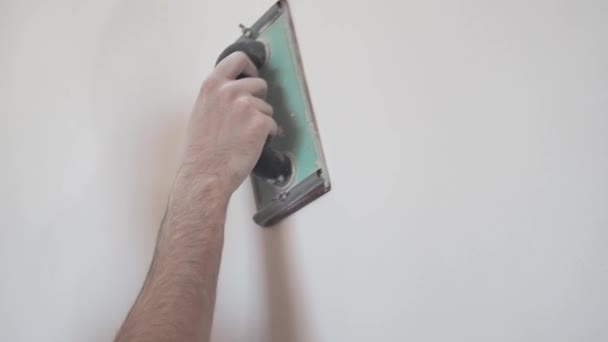 Man Smooth Out Hard Putty Wall Emery Paper Professional Repair — Stock Video
