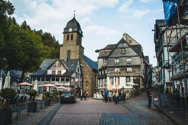 MONSCHAU, GERMANY - MAI 22 2019: Small picturesque town in the Eifel region in Noth Rhine-Westphalia. It is famous for its half-timbered houses and cobblestone streets