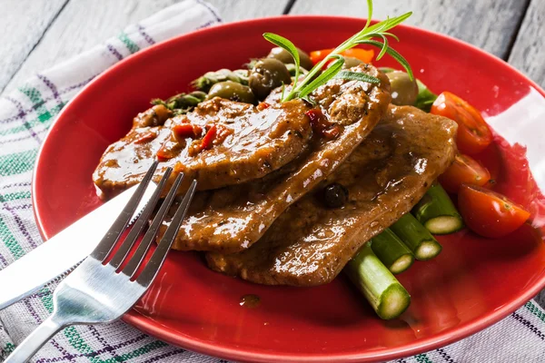 Pork chop with sauce and asparagus — Stock Photo, Image
