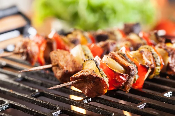 Grilling shashlik on barbecue grill — Stock Photo, Image