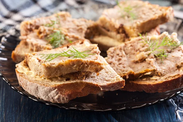 Slices of bread with baked pate on plate — Stock Photo, Image