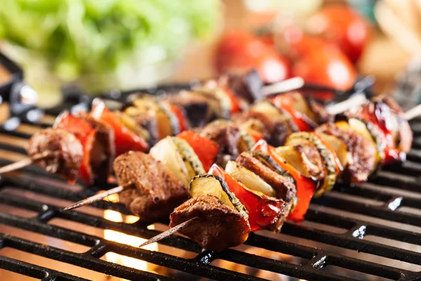 Grilling shashlik on barbecue grill — Stock Photo, Image