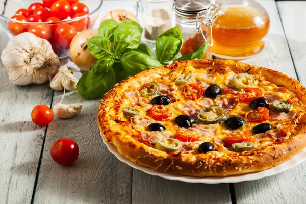 Pizza with bacon, olives and jalapeno pepper — Stock Photo, Image