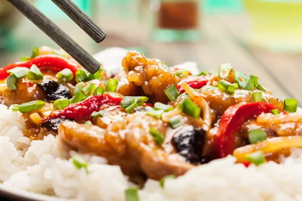 Sirloins on sweet and sour sauce served with rice — Stock Photo, Image