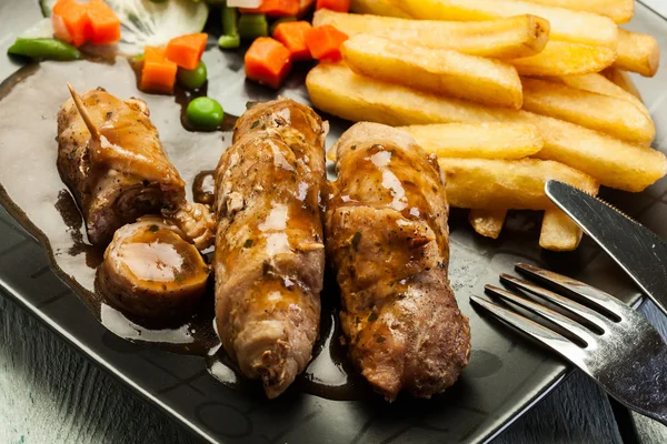 Pork rolls with french fries with vegetable — Stock Photo, Image