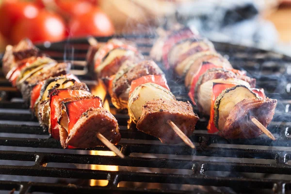 Grilling shashlik on barbecue grill — Stock Photo, Image