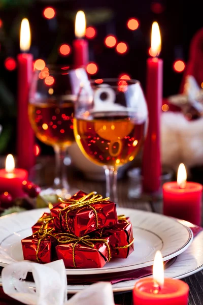 Christmas gift in dishware at the table — Stock Photo, Image