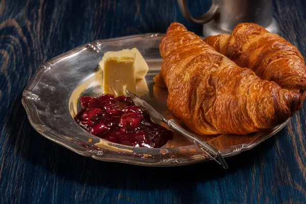 Croissants with butter and a glass of milk — Stock Photo, Image