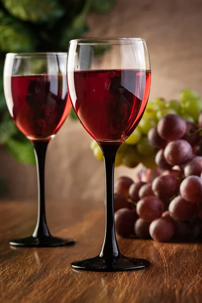 Glasses of red wine and bottle — Stock Photo, Image