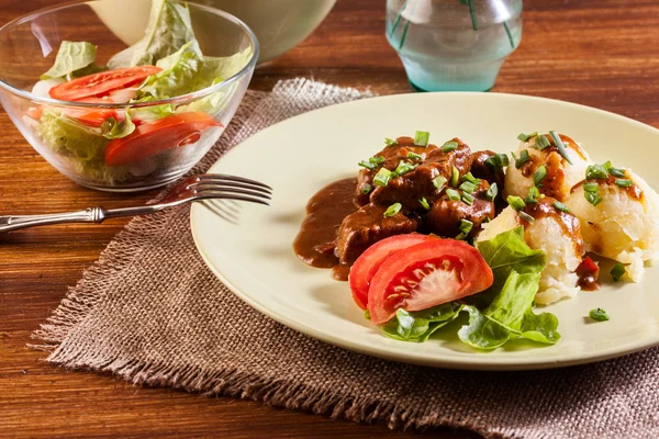 Goulash with boiled potatoes — Stock Photo, Image