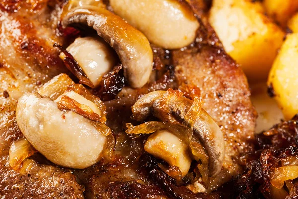 Closeup of roasted pork chop with mushrooms — Stock Photo, Image