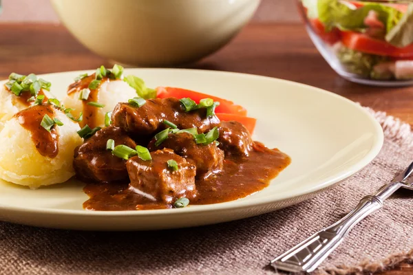 Goulash with boiled potatoes — Stock Photo, Image