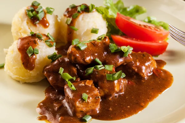 Goulash with boiled potatoes — Stock Photo, Image