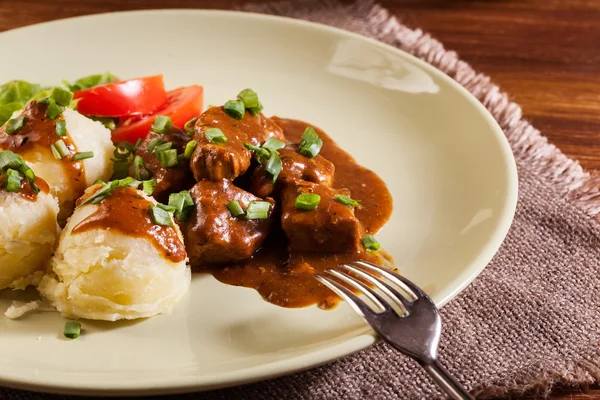 Goulash with boiled potatoes — Stock Photo, Image