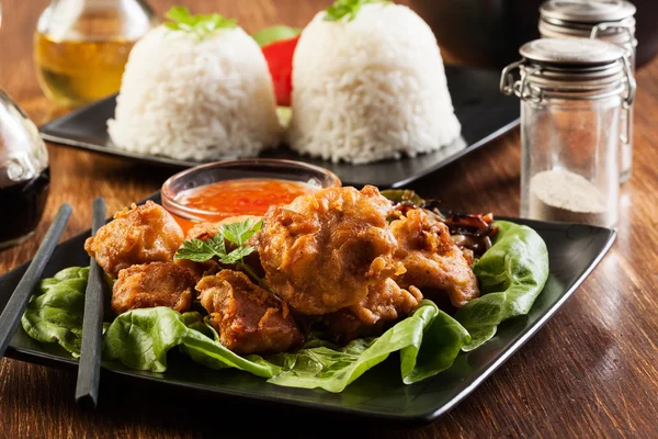 Fried chicken pieces in batter — Stock Photo, Image