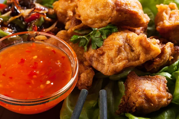 Fried chicken pieces in batter — Stock Photo, Image