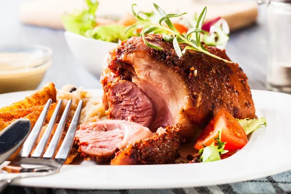 Pork knuckle with fried sauerkraut — Stock Photo, Image