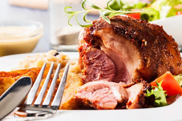 Pork knuckle with fried sauerkraut — Stock Photo, Image