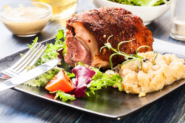 Pork knuckle with fried sauerkraut — Stock Photo, Image