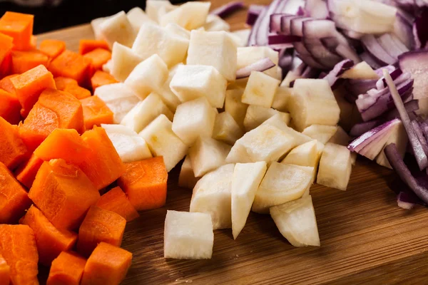 Chopped vegetables: carrots, parsley and onion — Stock Photo, Image