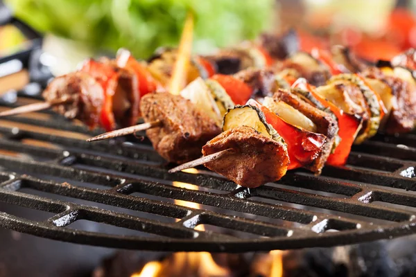 Grilling shashlik on barbecue grill — Stock Photo, Image