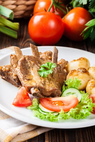 Pork spareribs served with silesian noodles and sauce — Stock Photo, Image