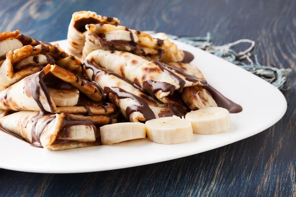 Crepes with banana and chocolate cream — Stock Photo, Image