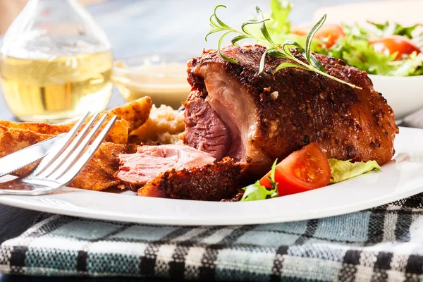 Pork knuckle with fried sauerkraut — Stock Photo, Image