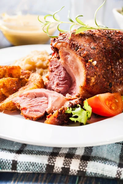 Pork knuckle with fried sauerkraut — Stock Photo, Image