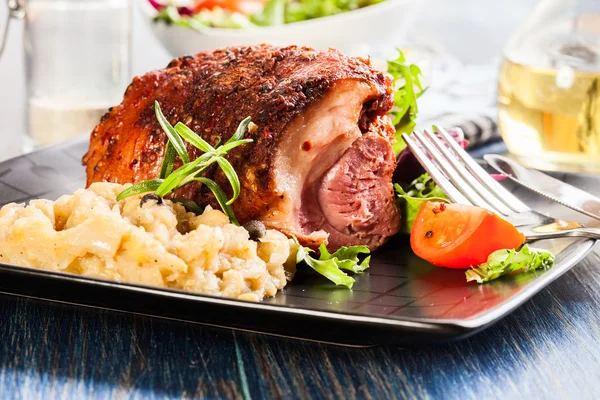 Pork knuckle with fried sauerkraut — Stock Photo, Image