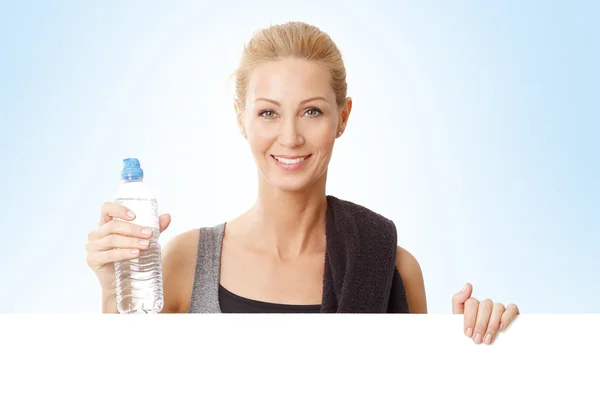 Woman holding  white blank signboard — Stock Photo, Image