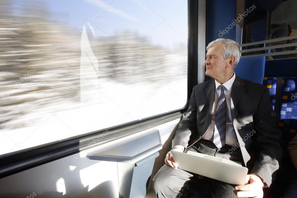 businessman sitting at train