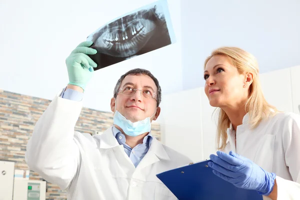 Dentist holding in his hand  x-ray film — Stock Photo, Image