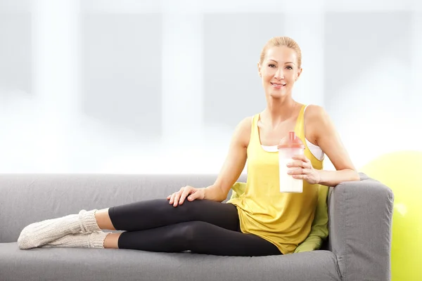 woman holding protein shaker