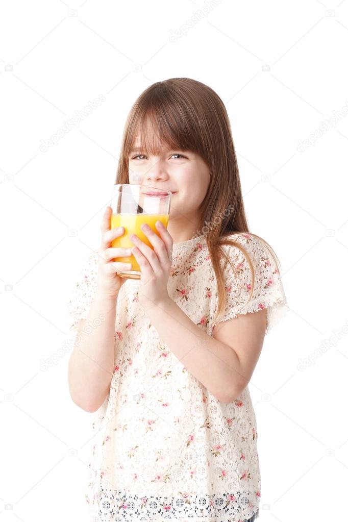 girl holding  glass of orange juice