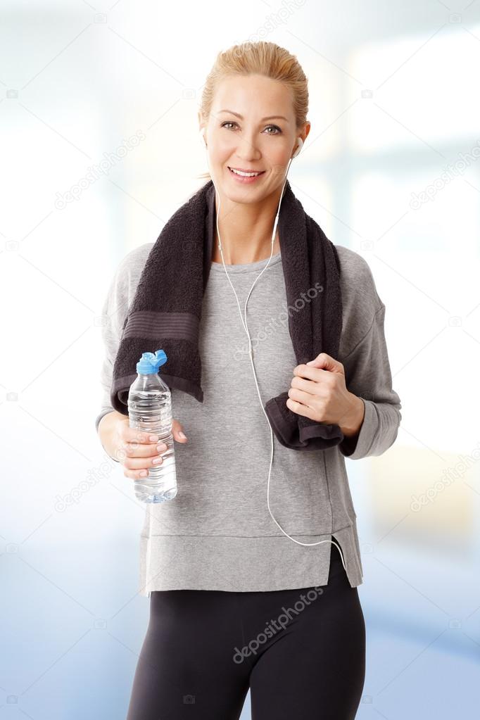 woman  holding a water bottle