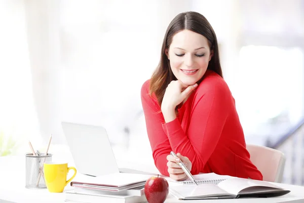 Student sitting in front of laptop — Stock Photo, Image