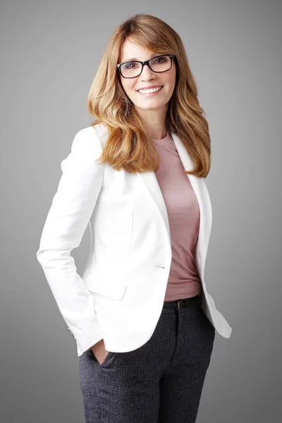 Attractive businesswoman standing Stock Image