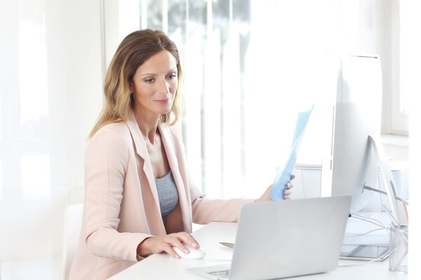 businesswoman sitting at her workplace