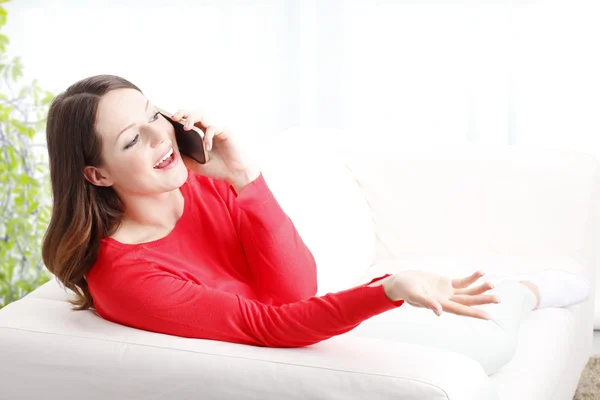 Beautiful young woman making call — Stock Photo, Image