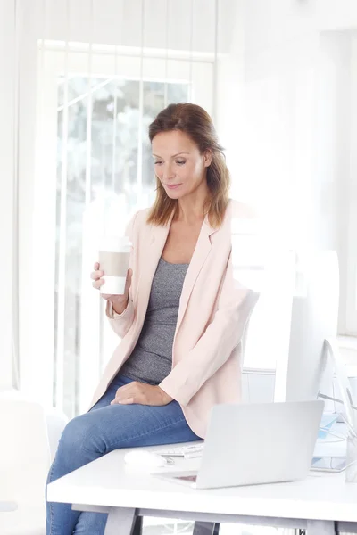 sales woman having  a coffee break